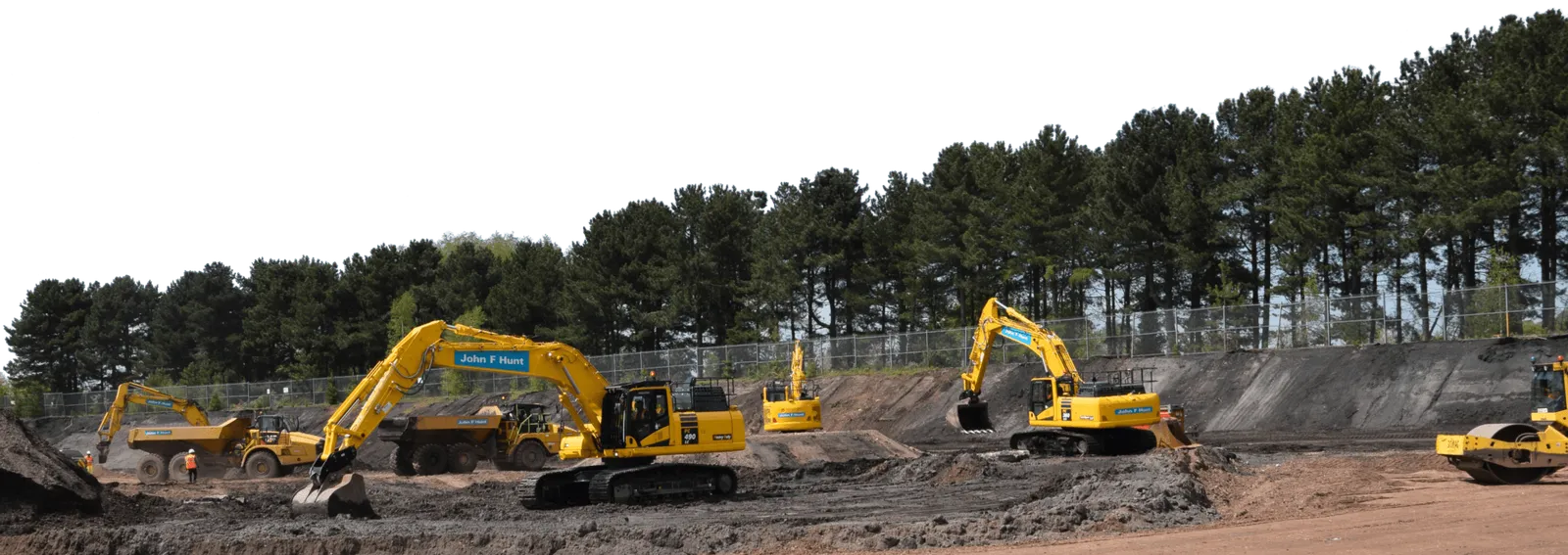 John F Hunt excavators, dump trucks and rollers on site